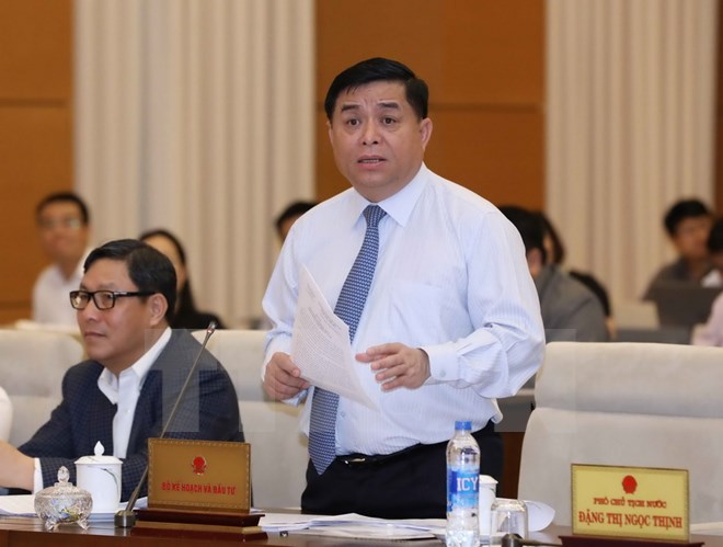 Bộ trưởng Bộ Kế hoạch và Đầu tư Nguyễn Chí Dũng phát biểu tại phiên họp. (Ảnh: Phương Hoa/TTXVN)