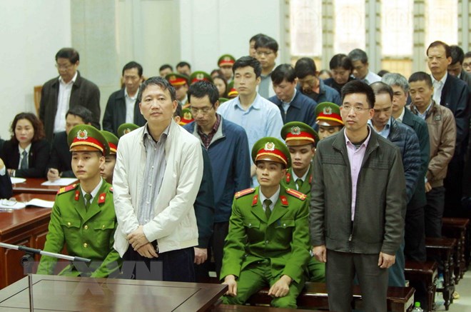 Bị cáo Trịnh Xuân Thanh và đồng phạm nghe tòa tuyên án. (Ảnh: An Đăng/TTXVN)