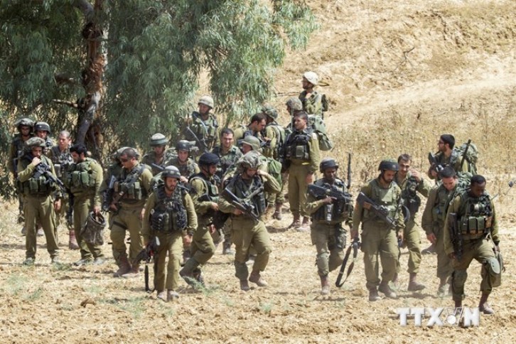 Binh sỹ Israel triển khai gần khu vực biên giới với Dải Gaza ngày 12-7.(Nguồn: AFP/TTXVN)