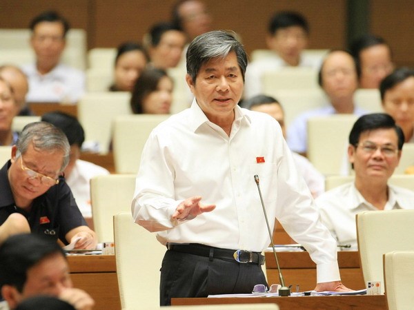 Bộ trưởng Bộ Kế hoạch và Đầu tư Bùi Quang Vinh trả lời chất vấn của đại biểu Quốc hội. (Ảnh : Doãn Tấn/TTXVN)